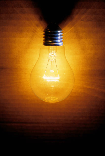 istock closeup of an old burning light bulb 1963028624