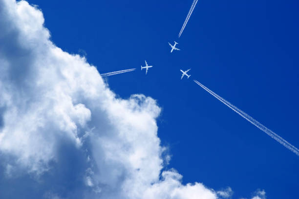 istock three aeroplanes fly exactly towards each other 1963037067