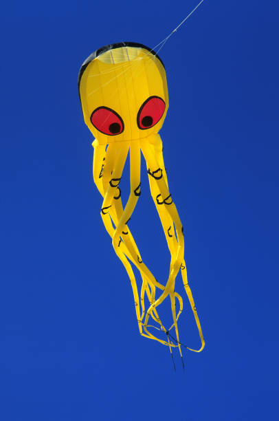istock a yellow kite in the shape of an octopus 1963041608