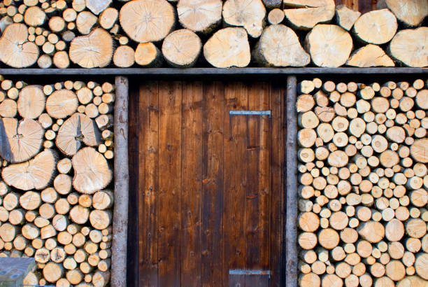 picturesque woodpile, more for decoration, sawn logs, at a wooden hut near Garmisch-Partenkirchen, Bavaria, Germany