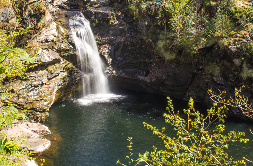 Looking down at the Falls of Falloch from the viewpoint. The Falls of Falloch is over 9m (30 feet) tall and are situated in the north of the Trossachs National Park, in Scotland;