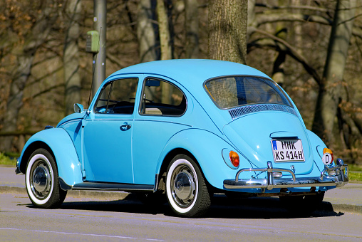 light blue VW Volkswagen beetle Käfer, parked, german license plate was altered, the first letters MHK do not exist in Germany