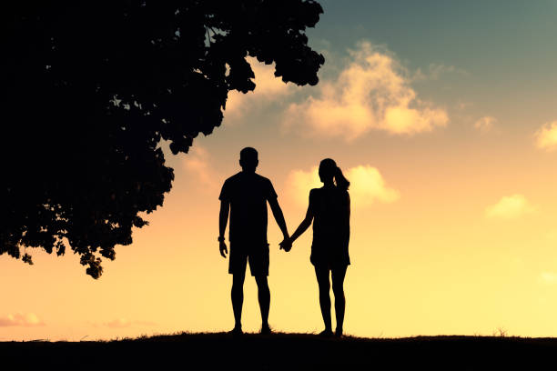 In love couple at sunset.