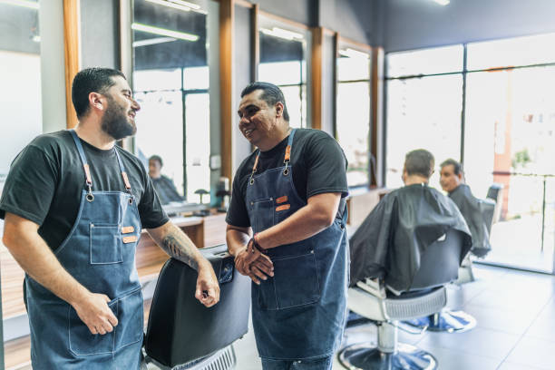 istock Barbers talking at barber shop 1963076838
