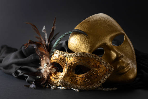istock Golden Venetian carnival masks on a black background. 1963081530