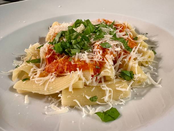 istock Fresh home made pasta with tomato sauce, fresh basil and parmesan cheese 1963087769