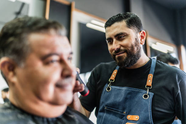istock Barber cutting customer hair's at barber shop 1963088292