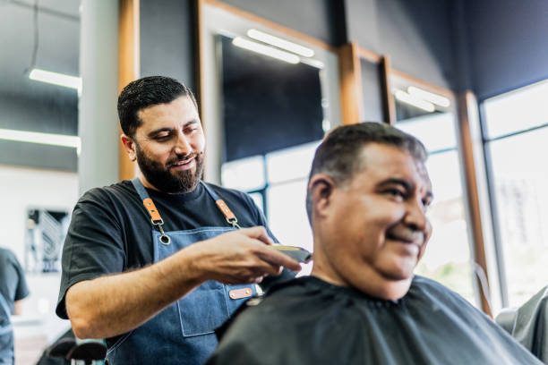 istock Barber cutting customer hair's at barber shop 1963088805
