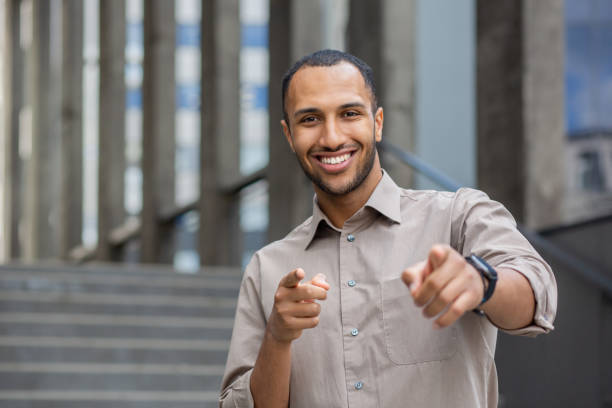 istock A confident man wearing a watch points directly at the camera, engaging the viewer with his gesture 1963091413