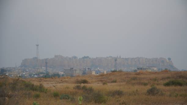 istock foggy distant landscape of grass and jaisalmer 1963114214