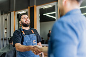 barber-greeting-his-customer-upon-arrivi