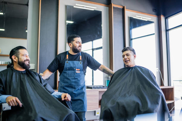 istock Barber talking to customers at barber shop 1963120987