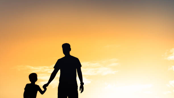 istock Father and son bonding at sunset. 1963160405