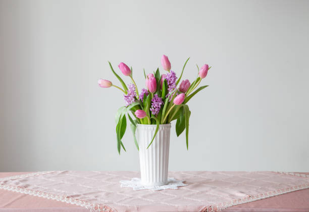 istock spring flowers in white vase in vintage style 1963190346