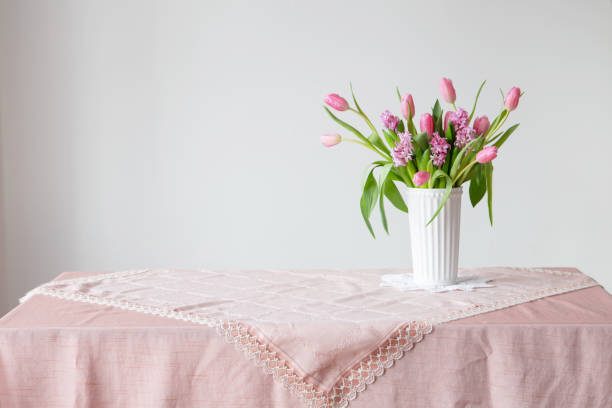 istock spring flowers in white vase in vintage style 1963190348