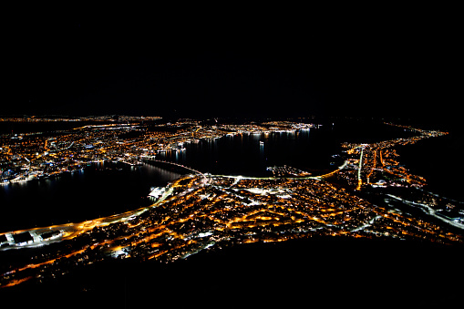 a night aerial view of the city of Tromso