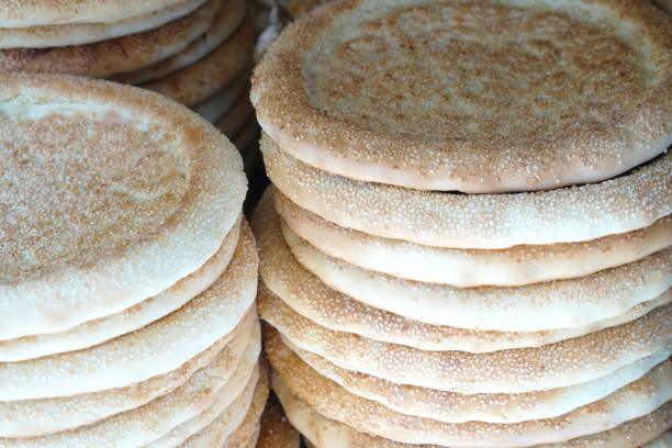 close up on stacking naan flat bread in Muslim market
