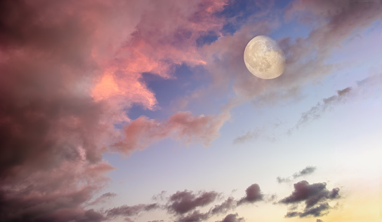 A Full Moon Is Rising In A Colorful Sunset Romantic Twilight Sky