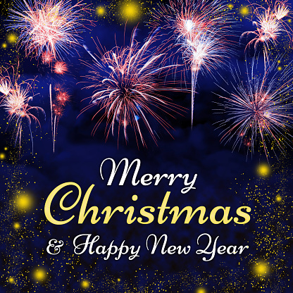 Merry Christmas and Happy New Year lettering on a night blue sky background with lots of beautiful fireworks and glowing lights.
