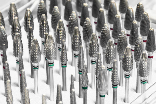 Dental drill bits Close-up of various chrome dental drill bits dental drill stock pictures, royalty-free photos & images