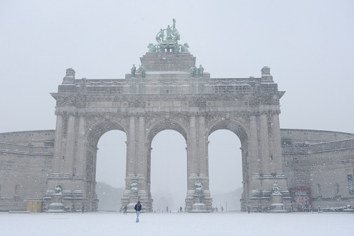 View of the snow covered Cinquantenaire Arch after heavy snowfall hit Brussels in Belgium on January 17, 2024.