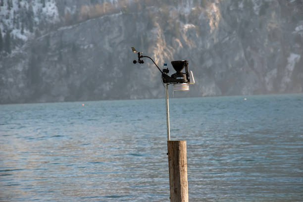 Lake Traunsee, Austria - 01.14.2024: Small weather station with cup anemometer and weathervane