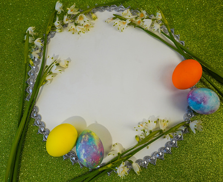 Collection of stylish colors eggs with flowers for Easter celebration on grey background. Holiday concept.