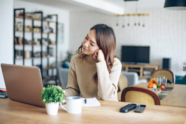istock Young female entrepreneur working on a laptop 1963466097