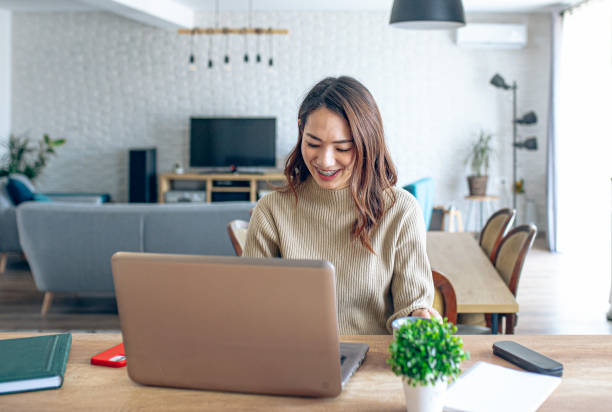 istock Young female entrepreneur working on a laptop 1963467162