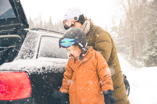 istock Mother and daughter getting unpacking the car for skiing 1963491488
