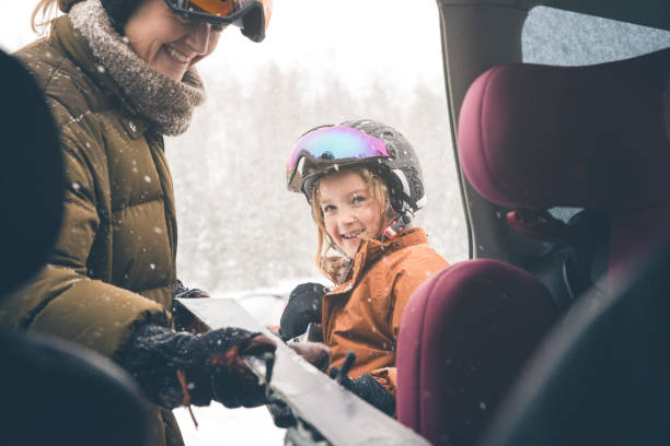 istock Mother and daughter getting unpacking the car for skiing 1963491490