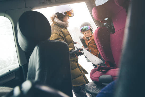 istock Mother and daughter getting unpacking the car for skiing 1963492515