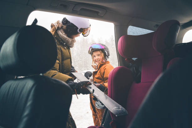 istock Mother and daughter getting unpacking the car for skiing 1963493027