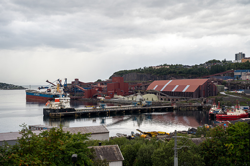 Narvik, Norway – August 23, 2023: Industrial boats moored in the Norwegian Harbor Narvik