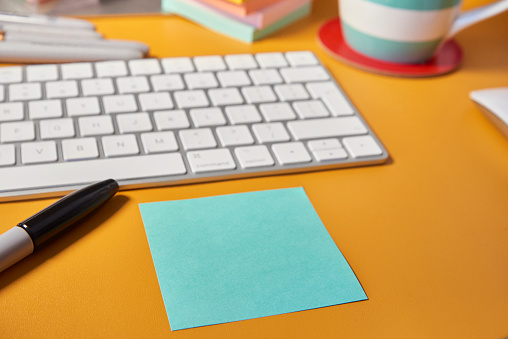 Sticky Note on Desk of brightly coloured Home Office Desk