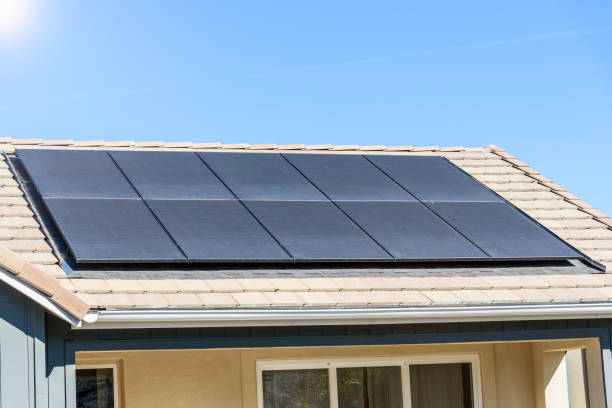 istock Rooftop of a new energy efficient detached house covered with solar panels 1963532234