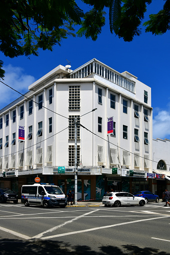 Nouméa, South Province, Grande Terre, New Caledonia: BNP Paribas bank and police car - BNP Paribas SA is one of the largest banking groups in the world. The bank was created in 2000 through the merger between Banque Nationale de Paris and Paribas Bank - corner of Général Gallieni and Antole France street.