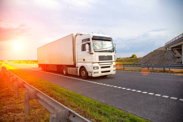 istock A white modern truck with an isothermal refrigerated semi-trailer transports perishable products in a trailer with a constant temperature regime. Transportation of seafood, fruits and meat. Copy space for text, sunset 1963542062