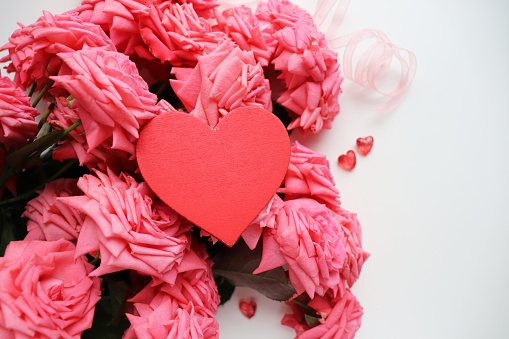 valentine's background. bouquet of flowers and valentine's heart