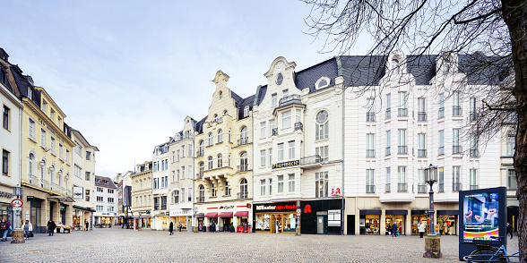 Bonn, Germany January 23 2024: old town houses with small stores on muensterplatz in the city center of bonn
