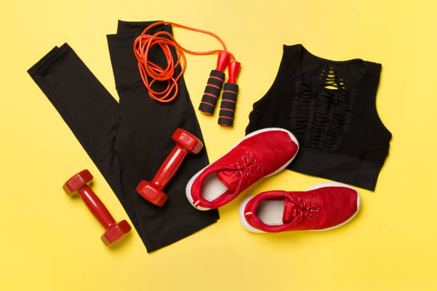 istock Black gym outfit on color background, top view 1963674496