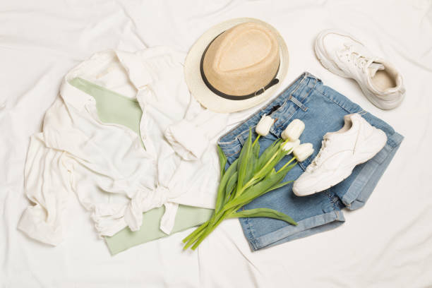 istock Stylish summer outfit on white sheet background, top view 1963674921
