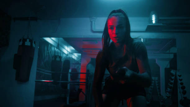 istock Female boxer does cardio or endurance exercises with ropes 1963681116