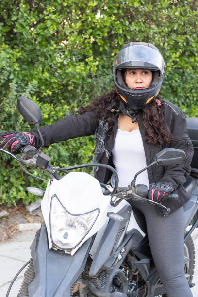 istock Confident Woman Preparing for Motorcycle Ride 1963782733