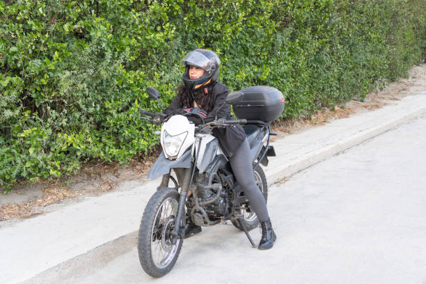istock Biker Woman Mounted on Motorcycle 1963784744