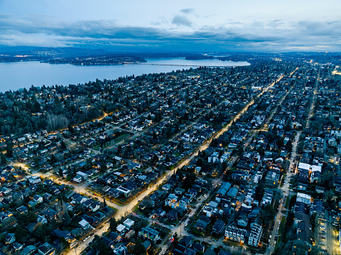 An aerial view of the Madonna neighborhood which is located along Lake Washington in Seattle Washington.  In the distance is the I-90 floating bridge and Lake Washington.