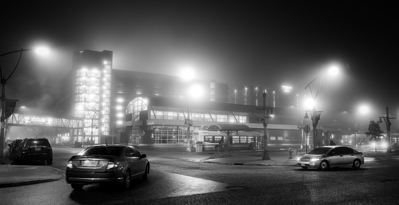 Windsor, Ontario, Canada - January 25, 2024: The downtown public bus terminal in Windsor, Ontario on a foggy evening.