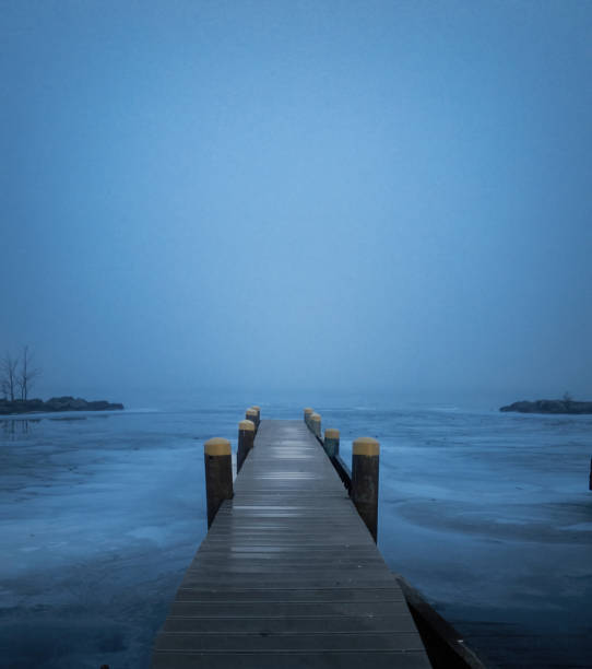 lake in winter in foggy weather, foggy day on the lake in winter season