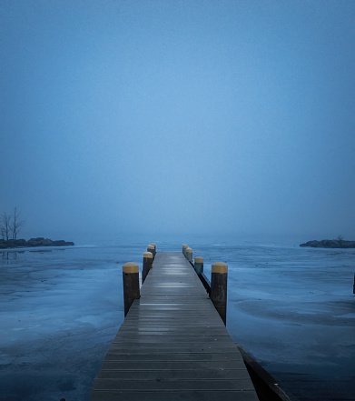 A view of the Detroit River on a foggy winter evening in Windsor, Ontario