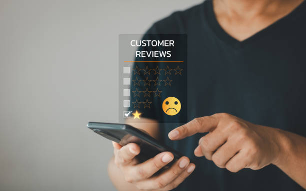istock Dissatisfied customer experience concept, unhappy businessman client with a sad emotion face on smartphone screen, bad review, bad service, dislike, bad quality, low rating, social media not good. 1963841916